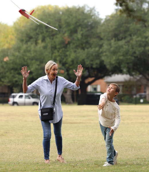 A woman plays with her grandchild while using the X-PLOR.